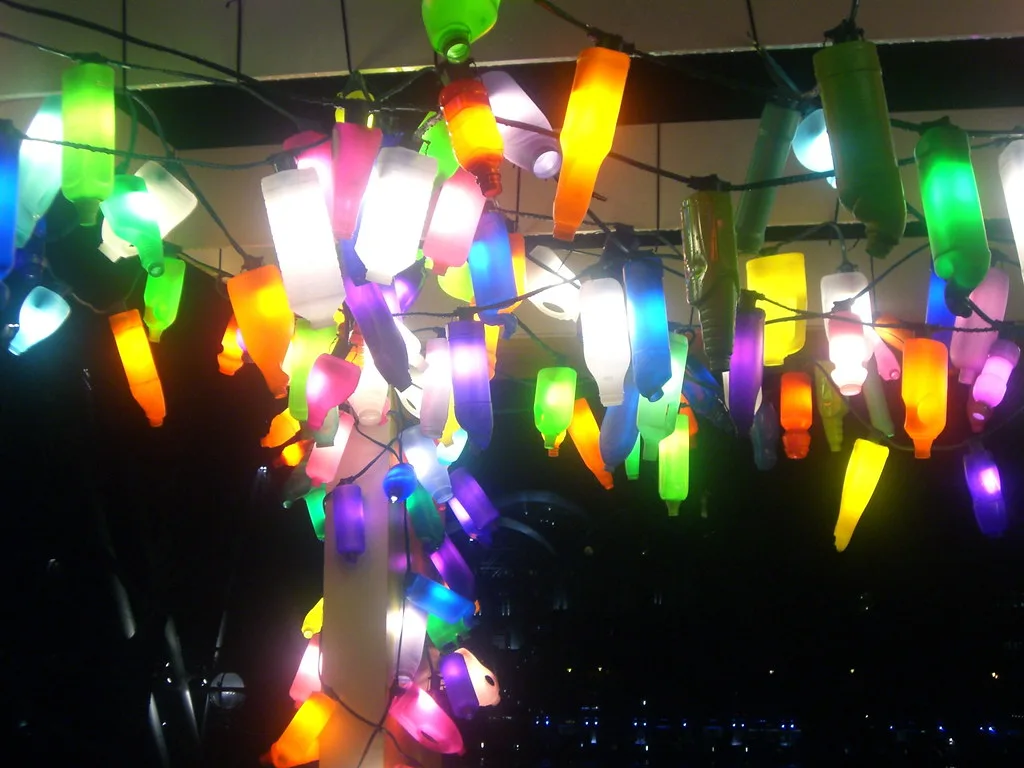 Strings of colourful bulb lights glowing at night