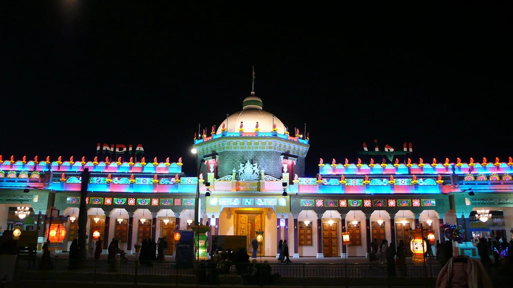 Building facade lit up with colourful lights at night